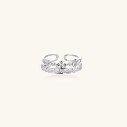 Adjustable gold-plated crown ring with zirconia crystals in ornate tiara design on white background.